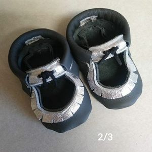 Black and silver moccasins